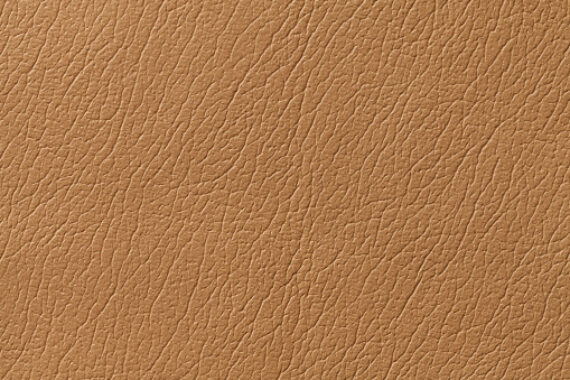 Light brown leather texture background with pattern, closeup.